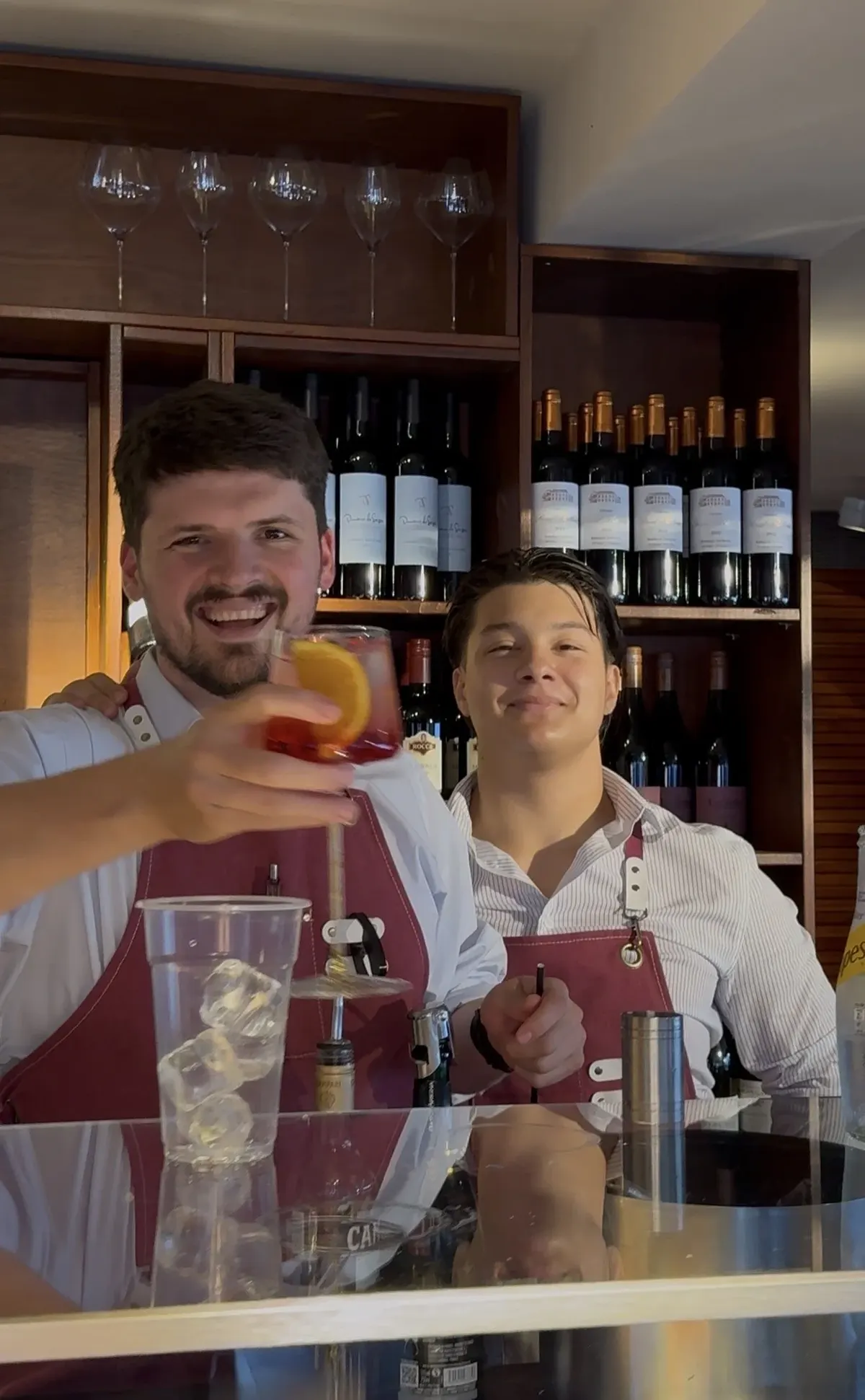 Two of the Chez Bernard team with drinks at the bar