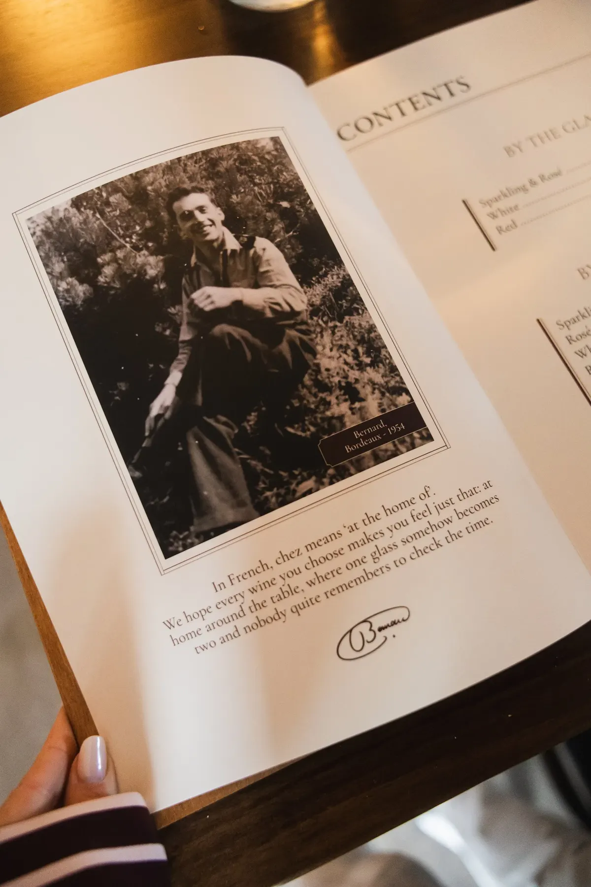 The printed Chez Bernard wine list, open at the contents page beside a photograph of Bernard in 1954